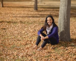 Photo of Paula Pant near a tree in fall