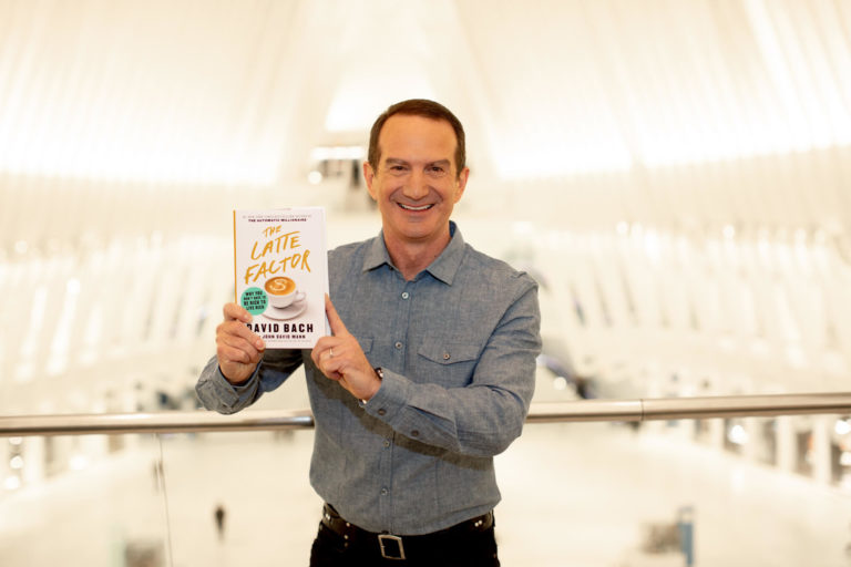 Photo of David Bach holding his book, The Latte Factor