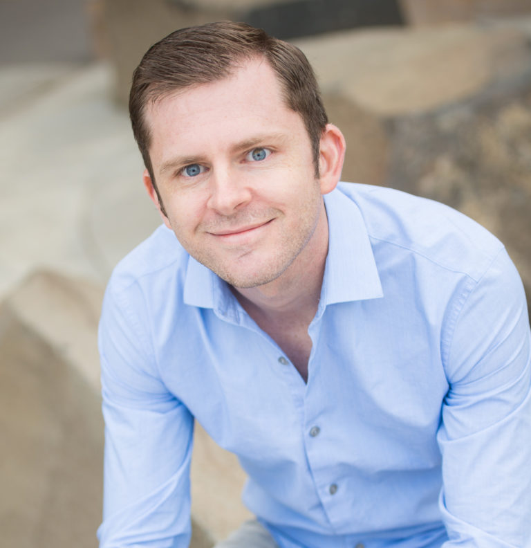 Photo of Chris Guillebeau in light blue button-down shirt