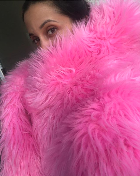 Photo of Paula under a pink shawl
