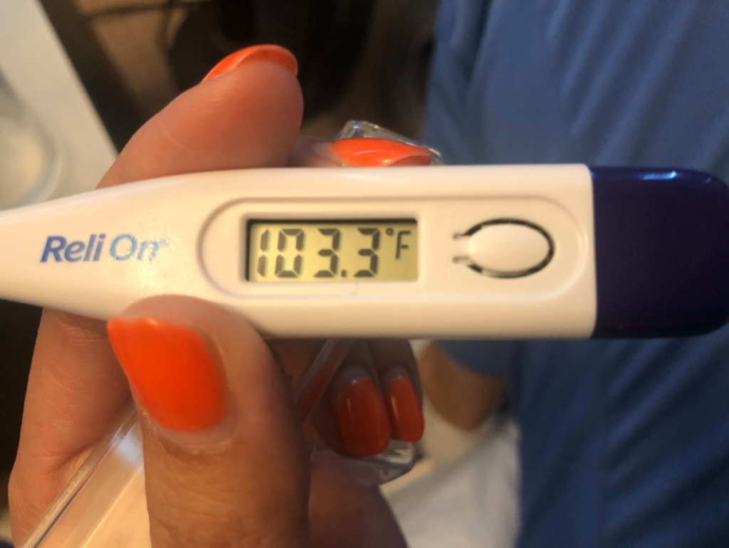 Photo of thermometer reading 103.3 degree fever