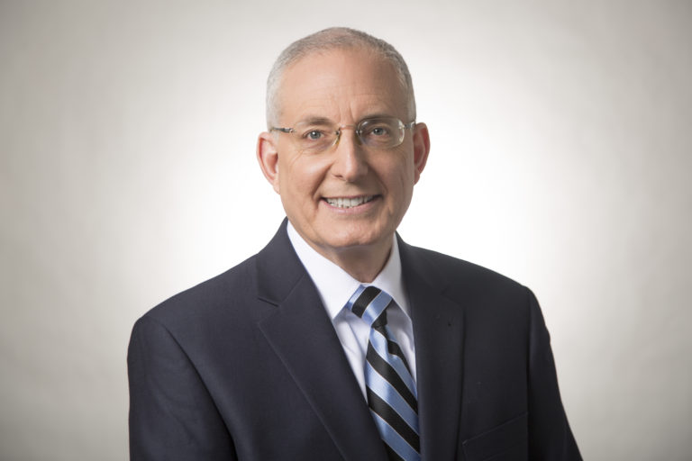Ed Slott in a suit against grey background
