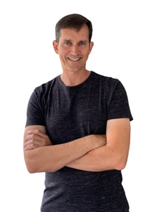 Rich Carey in a gray shirt against a white background