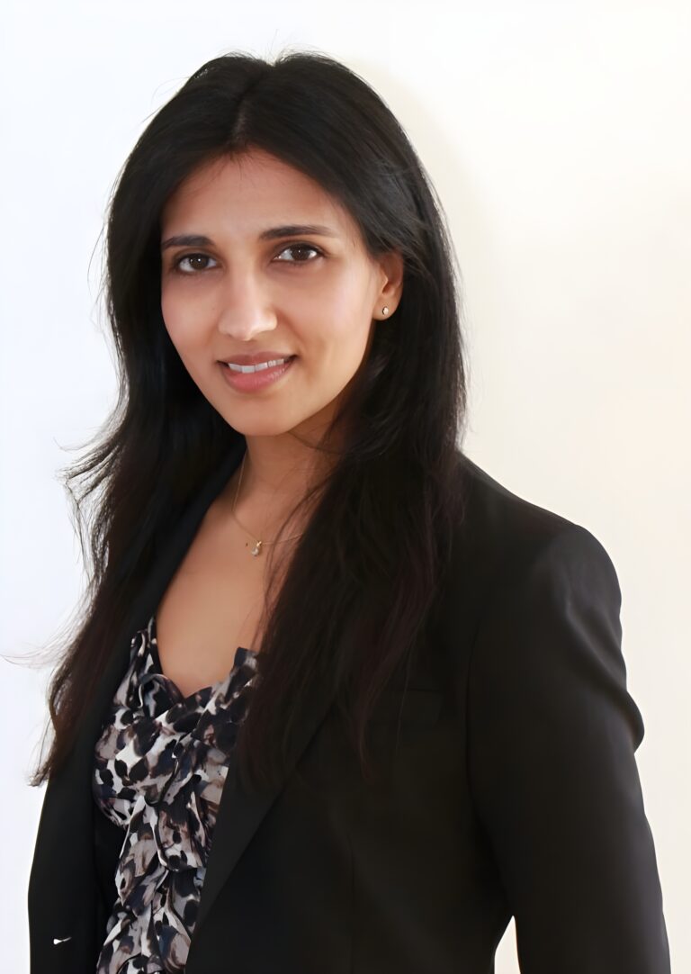 Dr Sunita Sah, expert in psychology of money, posing in front of the camera.