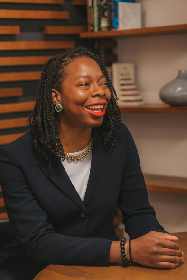 Etinosa Agbonlahor sitting on her office while she talks about how to have proper money conversations with your parents