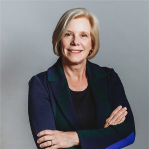 Harvard MBA and FCLTGlobal CEO Sarah Williamson - expert in different types of investing such as long term investing, posing in front of the camera. 
